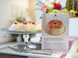 a dessert on a plate on a table with a cake at Best Western Hotel Martello in Lampedusa +41 photos