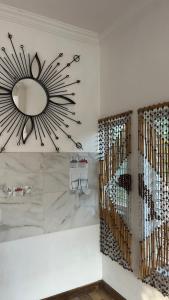 a room with a wine cellar with a large mirror at Hostal Axlan in Puerto Escondido