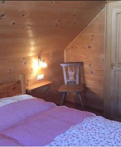 Кровать или кровати в номере Falkertsee, Chalet PANORAMA Pistenlage-und am See bis 11 Personen