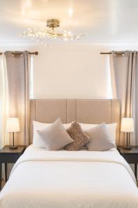 Voodi või voodid majutusasutuse Stunning home next to Excel, London City Airport and East London University toas +25 fotot