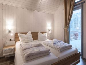En eller flere senge i et værelse på exklusives skandinavisches Ferienhaus