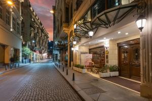 an empty street in a city at night at Pera Rose Hotel & Spa - Special Category in Istanbul