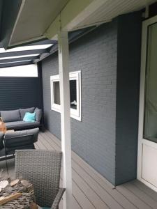 Et opholdsområde på Strandnahes Ferienhaus mit Wintergarten grosser uneinsehbarer Garten