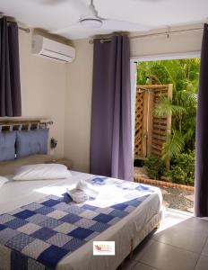 Ένα ή περισσότερα κρεβάτια σε δωμάτιο στο Villas Ixora