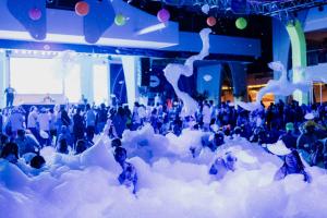 a group of people standing in a pile of snow at Riu Palace Peninsula - All Inclusive in Cancún