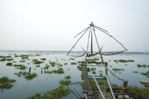 a pole in the middle of a body of water at The Lawrences Aqua Stay in Cochin