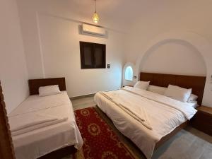 Ένα ή περισσότερα κρεβάτια σε δωμάτιο στο Bab Al Shams Palace