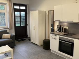 Η κουζίνα ή μικρή κουζίνα στο Business Apartments - Hof Wanstrath - select2stay