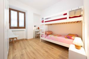 Postel nebo postele na pokoji v ubytování Casa Vacanze Cá Andriöi