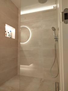 a shower with a glass door in a bathroom at Nunes Luxury in Ronda
