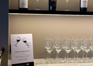 a bunch of wine glasses sitting on a shelf at Hotel Palermitano by DOT Boutique in Buenos Aires +48 photos