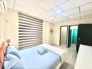 Una cama o camas en una habitación de Hermosa Casa En Opalo 22 fotos más