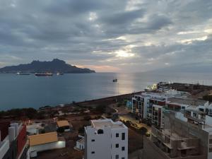 a view of a city and the water with buildings at Residencial P&P in Mindelo
