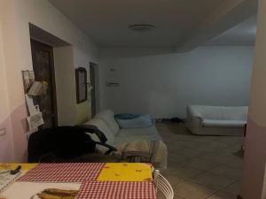 a living room with a couch and a table at SnowPeak Residence in Dresano