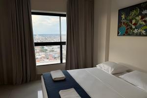 En eller flere senge i et værelse på Cozy with Stunning View on the 33rd floor + 12 billeder