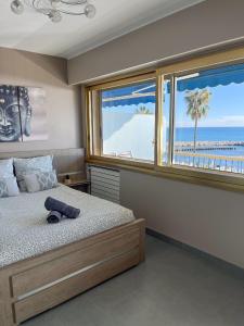 Ένα ή περισσότερα κρεβάτια σε δωμάτιο στο Appartement vue mer