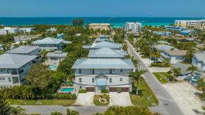 an aerial view of a house with the beach in the background at Casa Antilles - 1036L in Siesta Key