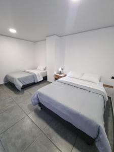 Giường trong phòng chung tại Andes Coliving