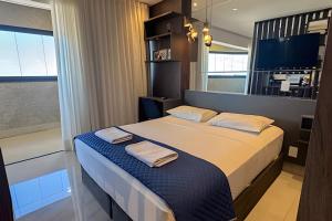 Postel nebo postele na pokoji v ubytování 23 Andar no Vertigo Premium com Vista Espetacular + 10 fotografií