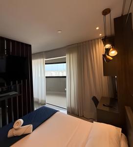 Postel nebo postele na pokoji v ubytování 23 Andar no Vertigo Premium com Vista Espetacular