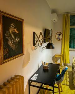 a dining room with a table and a painting of a duck at Hotel Continental Cassino in Cassino