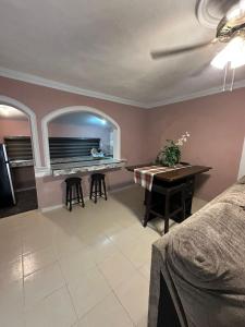 a living room with a piano and a desk at Departamentos Mateo'S 655 in Ciudad Acuña