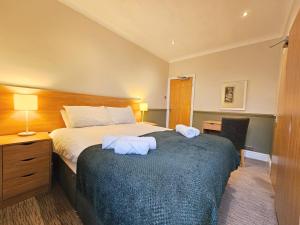 Ένα ή περισσότερα κρεβάτια σε δωμάτιο στο Derwent Manor Apartments +49 φωτογραφίες