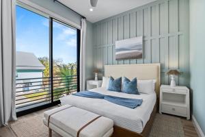 a bedroom with a bed and a large window at Point of Paradise - 7007 in Sarasota +70 photos