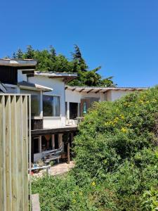 a house with a fence in front of it at Vistas espectaculares in Mirasol