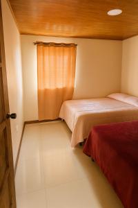 Postel nebo postele na pokoji v ubytování KEYTRI Rooms