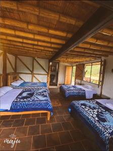 Postel nebo postele na pokoji v ubytování Hotel Rancho Maju + 18 fotografií