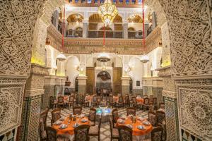 an overhead view of a dining room with tables and chairs at Riad Fes Palais Bab Sahra Suites & Cooking Workshops in Fez