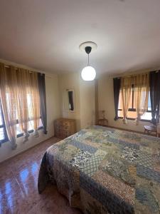 Postel nebo postele na pokoji v ubytování Los Palmeros + 7 fotografií