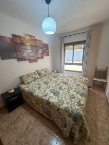 Postel nebo postele na pokoji v ubytování Los Palmeros