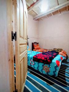 Una cama o camas en una habitación de Auberge le calme restaurante