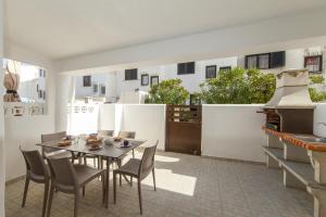 a dining room with a table and chairs at C06 - Water Tower Townhouse in Lagos