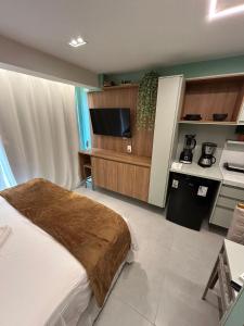 Kuchyň nebo kuchyňský kout v ubytování Melhores Flats - Seu desejo, pé na areia