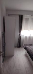 Ένα ή περισσότερα κρεβάτια σε δωμάτιο στο LCB Apartments P Victoriei Ploieşti