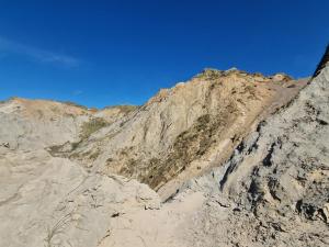 a rocky mountain with a blue sky in the background at 4 person holiday home in Hjørring-By Traum in Lønstrup