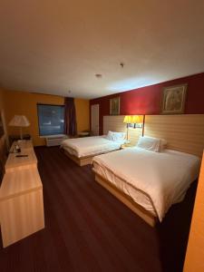 Ένα ή περισσότερα κρεβάτια σε δωμάτιο στο Ashburn inn