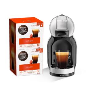 una cafetera y una caja con un vaso de café en Anais Loc, en La Trinité