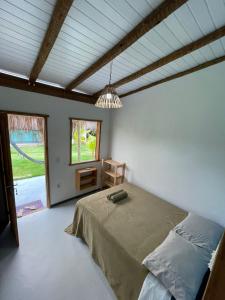 Postel nebo postele na pokoji v ubytování Dona Canoa Hospedaria