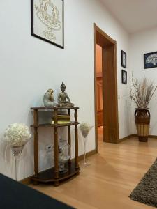 a room with a table with vases on it at Alojamento Luna in Porto Judeu +22 photos