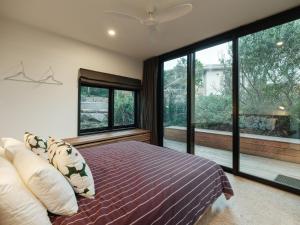 Ένα ή περισσότερα κρεβάτια σε δωμάτιο στο Obliqua