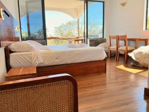 En eller flere senge i et værelse på Galapagos Yes