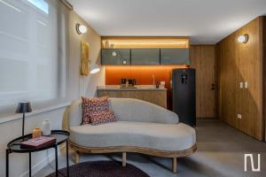 a living room with a couch and a refrigerator at NOK Luxury 3BR in Bogota with Terrace in street 84 in Bogotá