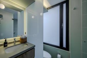 a bathroom with a sink and a mirror at NOK Luxury 3BR in Bogota with Terrace in street 84 in Bogotá