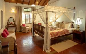 Ένα ή περισσότερα κρεβάτια σε δωμάτιο στο Eladetta Walauwa