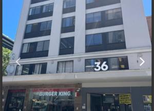 a building with a burger king sign in front of it at Cosmic Leopard in Cape Town