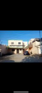 a car is parked in front of a building at Departamento Privado en Los Cabos in San José del Cabo